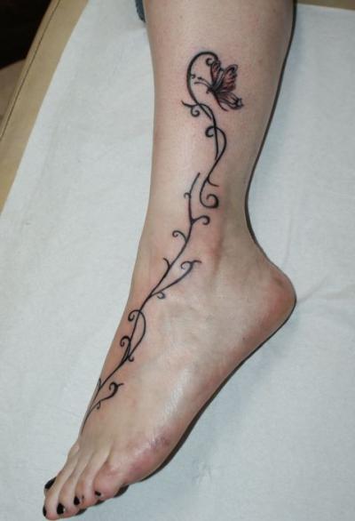 Nos ralisations - Arabesques - Arabesque et papillon Boutique Tattoo Evolution Perpignan